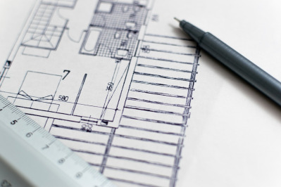 Engineers reviewing blueprints